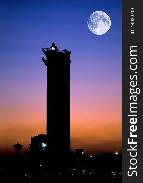 A modern lighthouse beautifully lit at dusk time. A modern lighthouse beautifully lit at dusk time