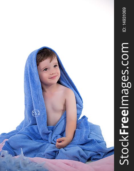 Little boy in towel looking away. Little boy in towel looking away