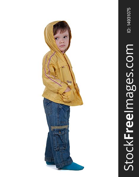 Boy in yellow jacket posing on a white background. Boy in yellow jacket posing on a white background