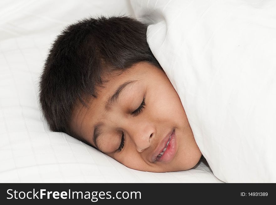 A handsome indian kid smiling for you