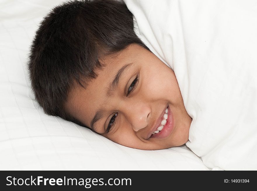 A handsome indian kid smiling for you