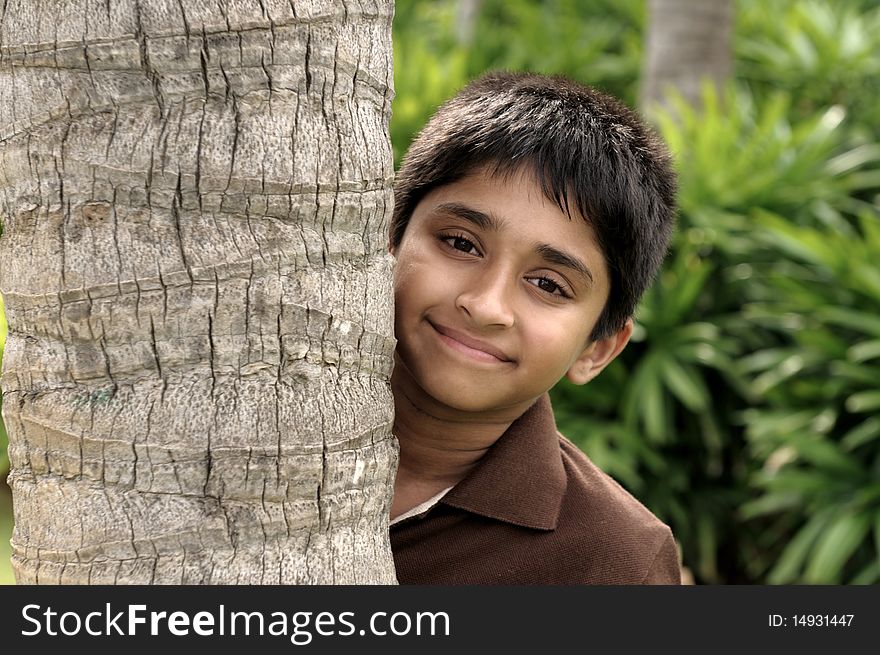 Handsome indian kid looking eagerly to the camera