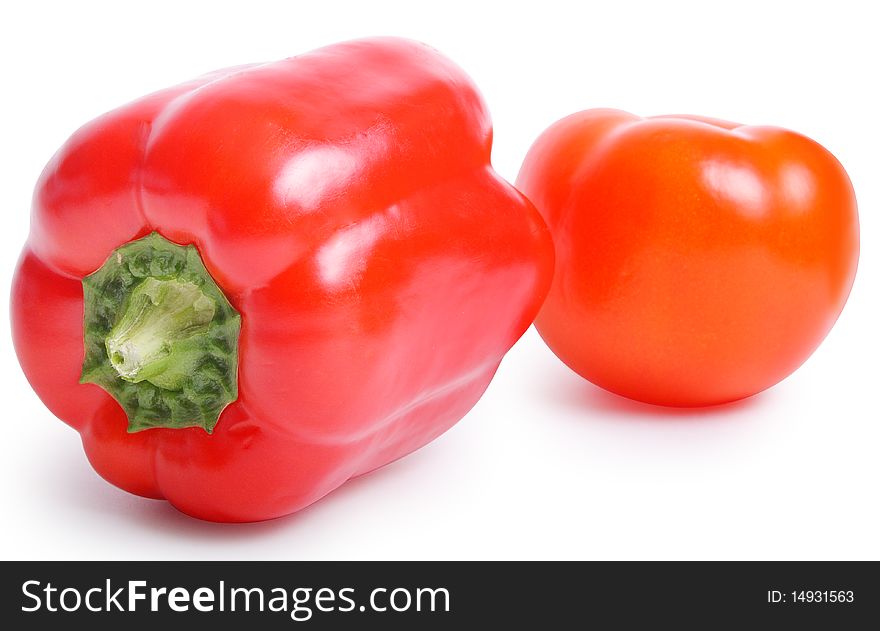 Tomato and pepper on white