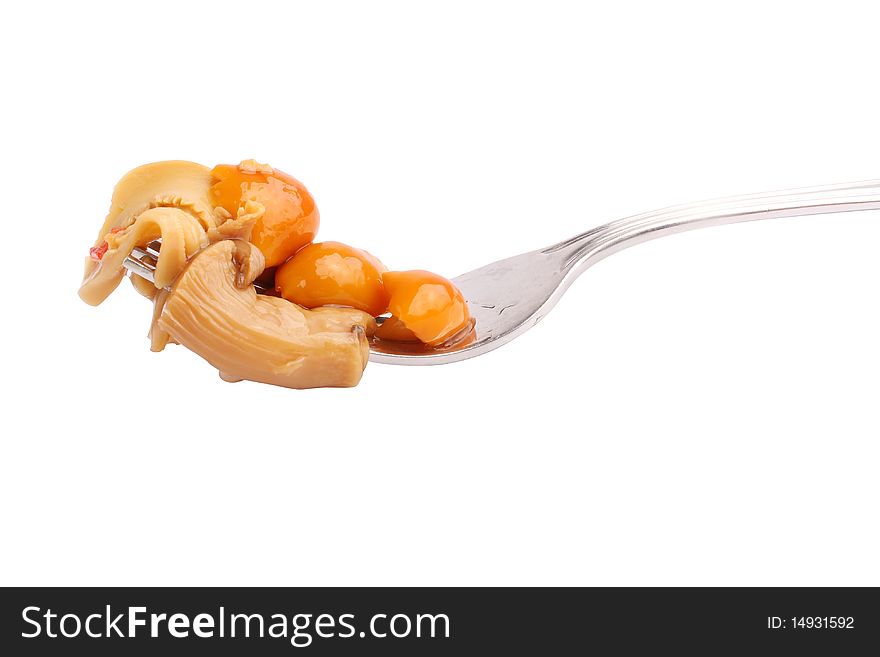 Delicious mushrooms on fork (isolated, clipping path)