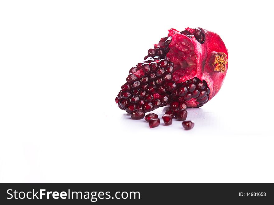 Image of a Pomegranate broken and isolated. Image of a Pomegranate broken and isolated