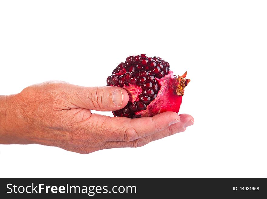 Image of a hand giving a Fresh Broken Pomegranate. Image of a hand giving a Fresh Broken Pomegranate