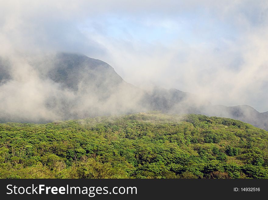 Lush green mountains and low hanging clouds. Lush green mountains and low hanging clouds