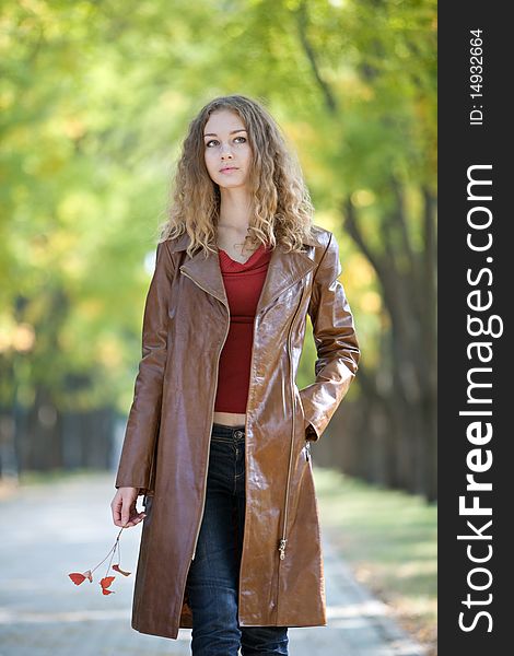 Young beauty woman in autumn outdoor