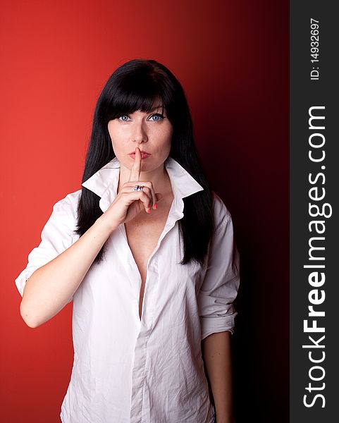 Woman's portrait on red background. Woman's portrait on red background