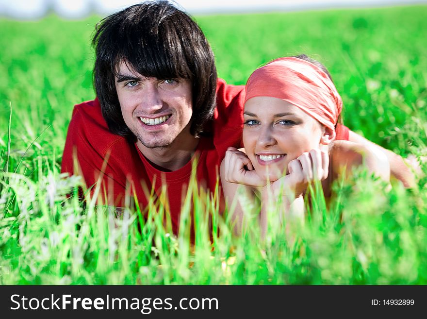 Girl and boy on grass