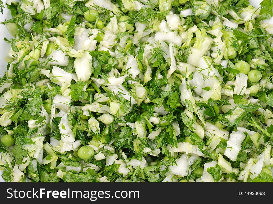 Fresh salad from vegetables and greens on a plate. Fresh salad from vegetables and greens on a plate