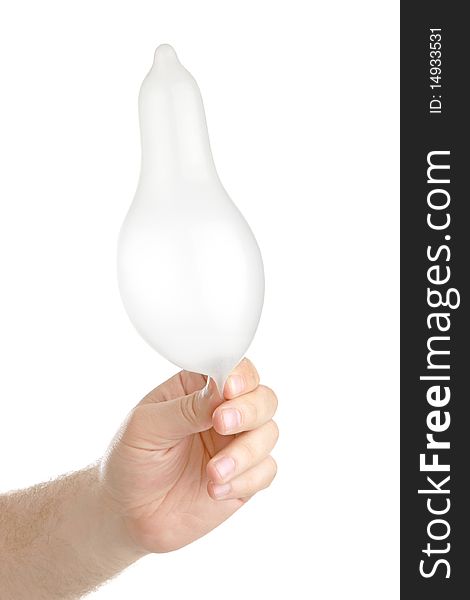 Man's hand with condom , closeup, isolated background