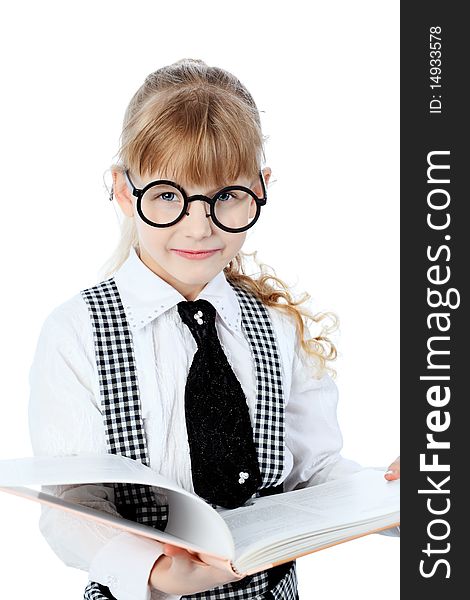 Shot of a little girl in glasses standing with books. Isolated over white background. Shot of a little girl in glasses standing with books. Isolated over white background.