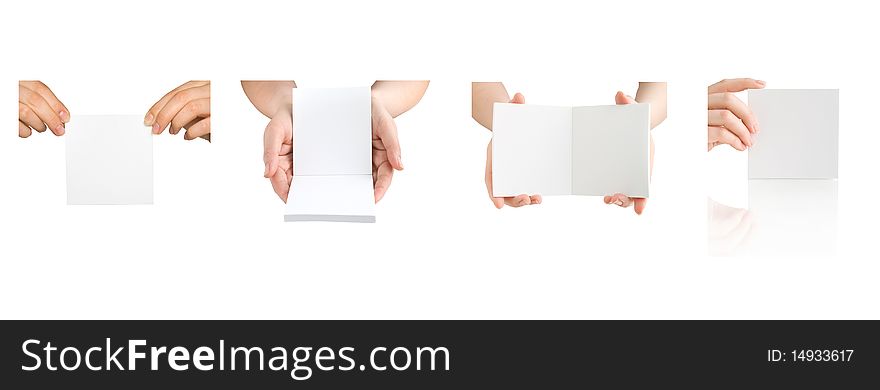 Collection of notebooks in hand isolated on white