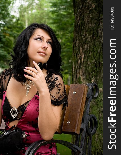 Romantic image of brunette girl in park