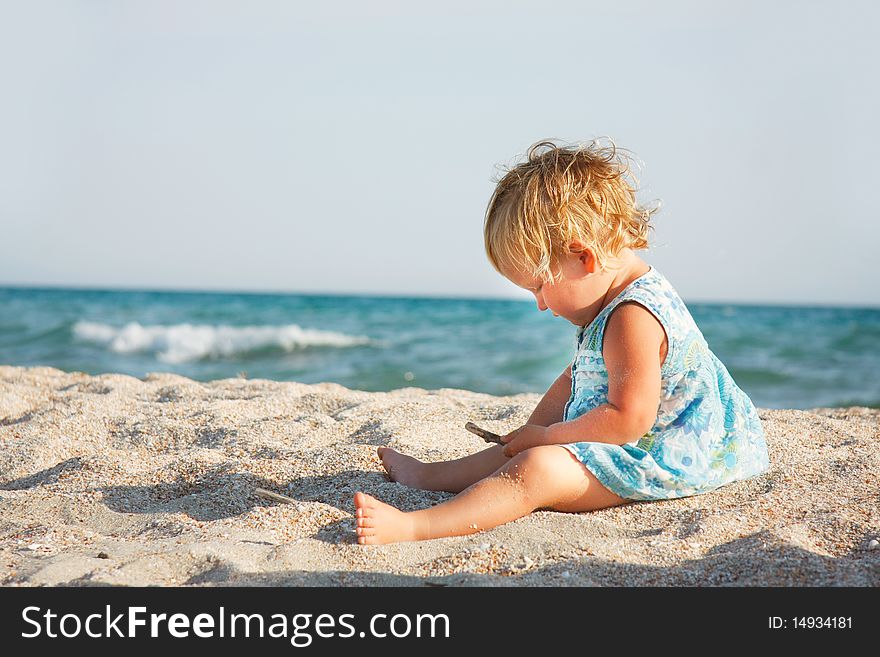 Cute toddler girl on beach