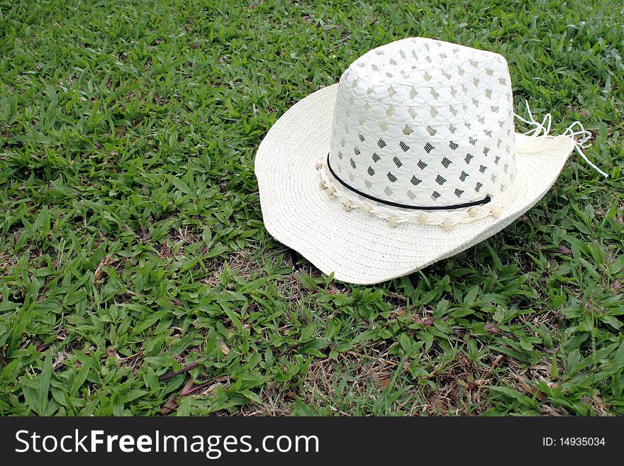 White hat on green grass