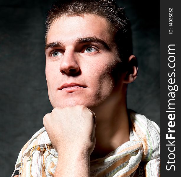 Young  male model  posing in colorful scarf