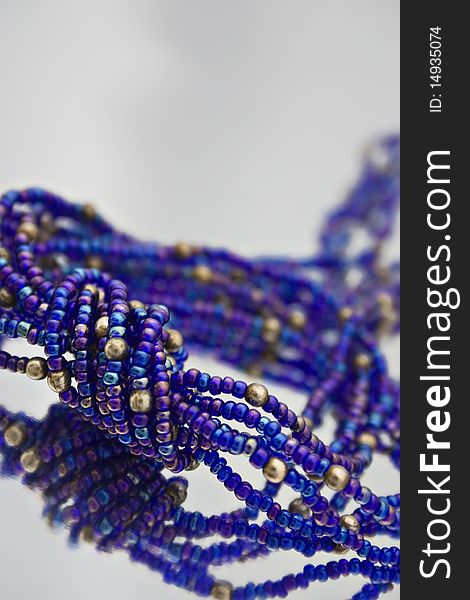 Strands of blue iridescent beads. Strands of blue iridescent beads