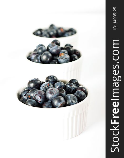 Shot of fresh organic blueberries in ramekins
