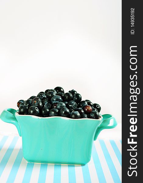 Shot of bowl of blueberries on lines vertical