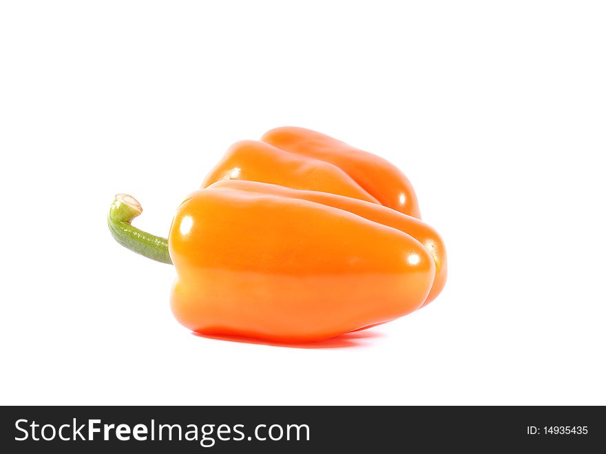 Two orange sweet peppers isolated over white background. Two orange sweet peppers isolated over white background