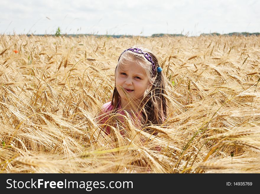 An image of a little girl in the field