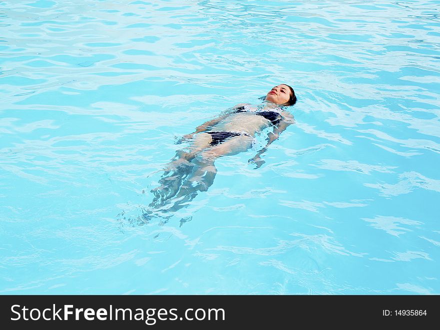 Girl in the pool alone. Girl in the pool alone