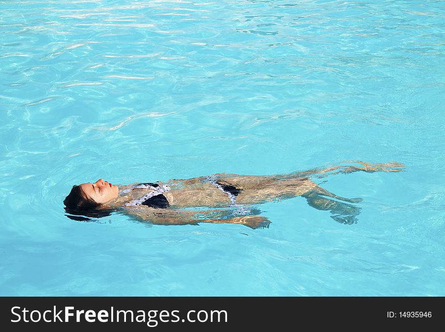 Girl in the pool alone. Girl in the pool alone