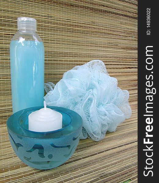 Blue bottle, bath sponge and votive candle. Blue bottle, bath sponge and votive candle