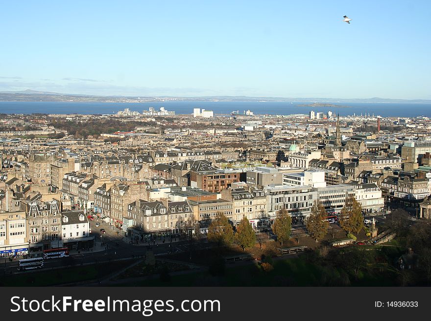 Taken from Edinburgh Castle this photograph looks North over Edinburgh and out to the sea. Taken on St. Andrews Day (November 30th) 2009, the patron saint of Scotland. Wonderful view of Prince's Street, the shadow from the Castle and the beautiful architecture. Taken from Edinburgh Castle this photograph looks North over Edinburgh and out to the sea. Taken on St. Andrews Day (November 30th) 2009, the patron saint of Scotland. Wonderful view of Prince's Street, the shadow from the Castle and the beautiful architecture.