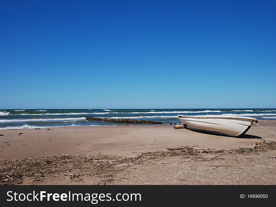 Breakwater at sea and fishing boat