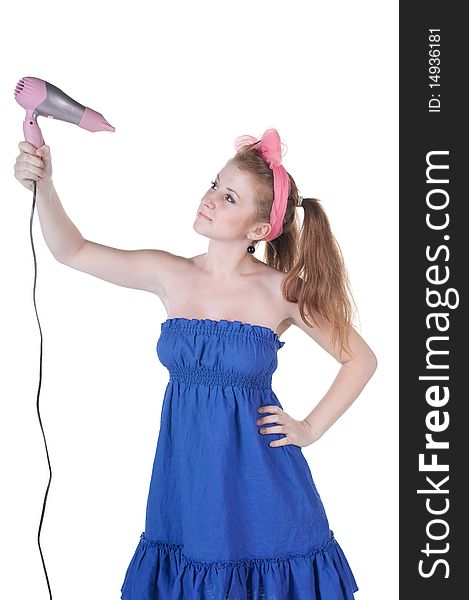 Red-haired girl with the hair dryer. Isolated over white .