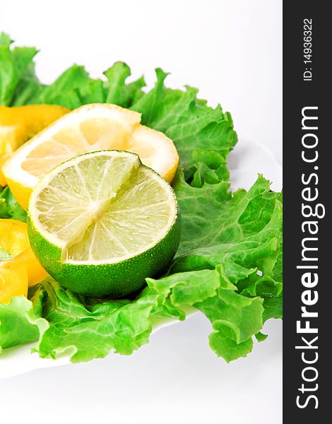 Various lemons with lettuce on white plate