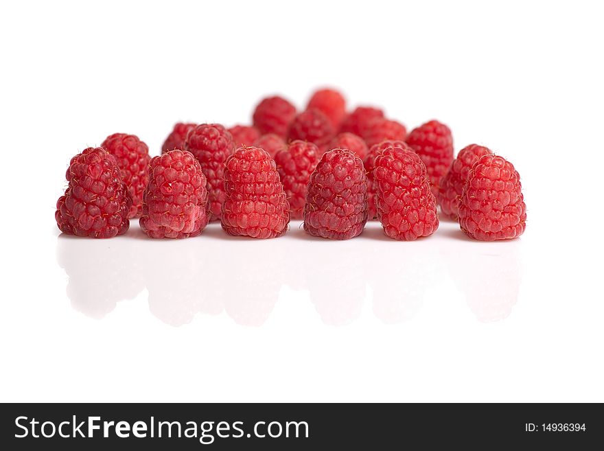 Ripe fresh rapberries on white isolated background
