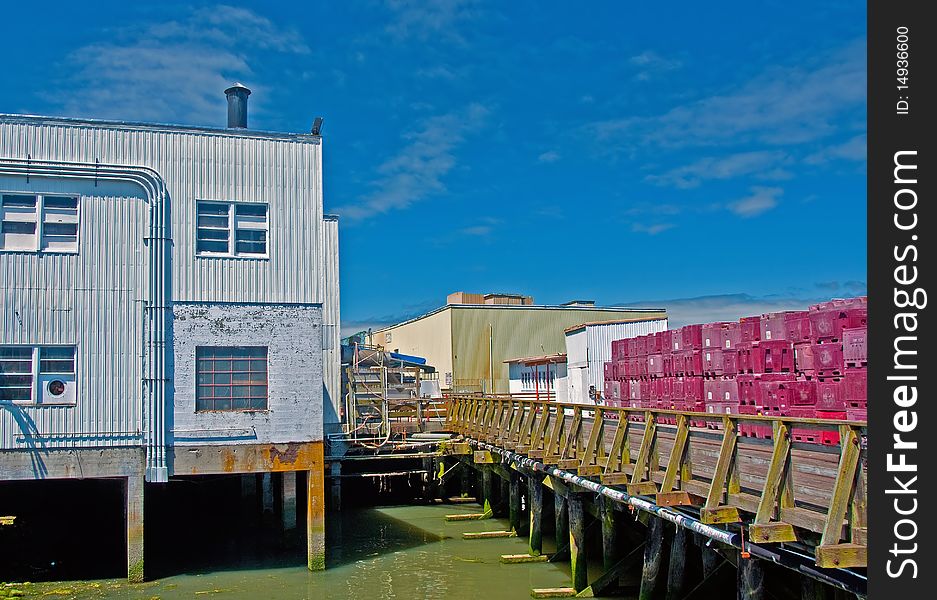 Fish cannery building, railroad tracks and fish boxes