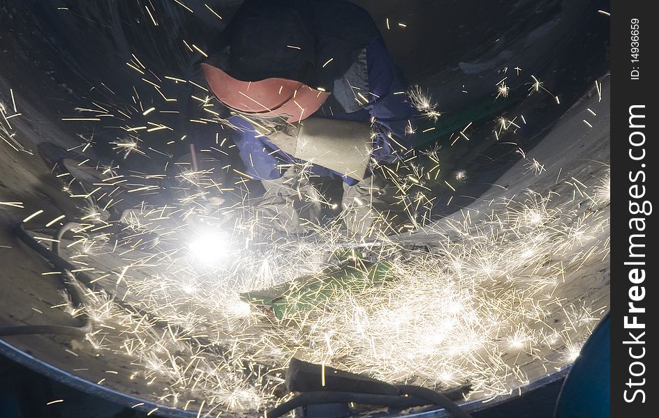 Welder Welding Metal And Sparks