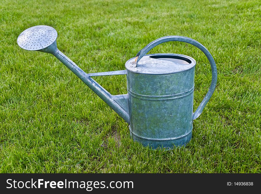 Garden a watering can to water a lawn a grass