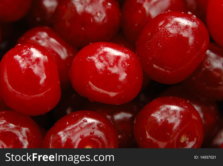 Ripe cherry with droplets close up