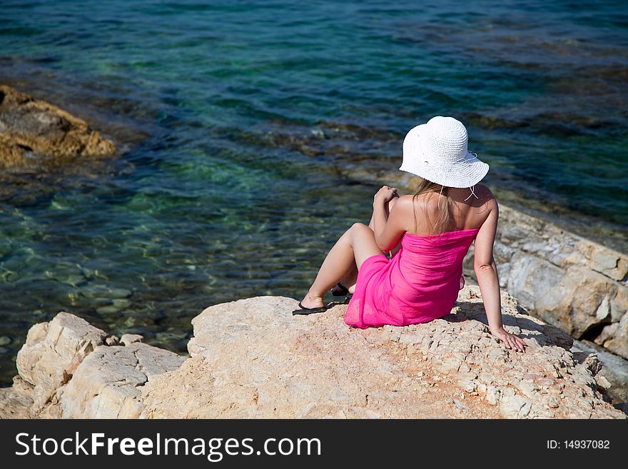 Natural caucasian woman tanning on exotic beach