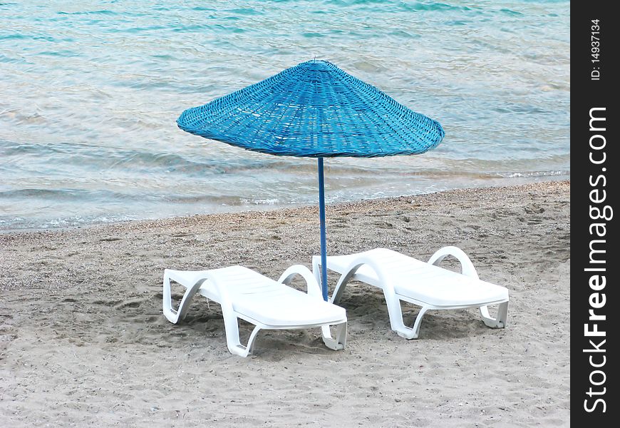 Sun-tent And Two Sun-beds On The Beach