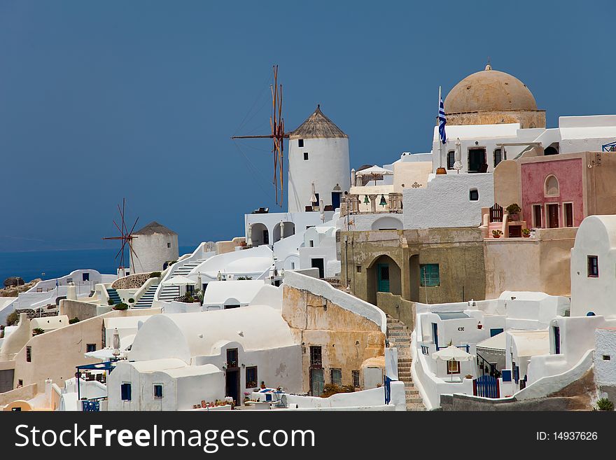 Santorini beautiful volcanic island in Greece landscape with blue churches, windmills and volcanic caldera