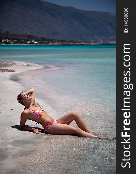 Natural caucasian woman tanning on exotic beach. Natural caucasian woman tanning on exotic beach
