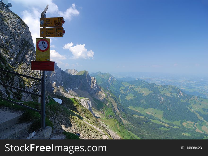 Signpost in the Alps along an Alpine trail. Signpost in the Alps along an Alpine trail