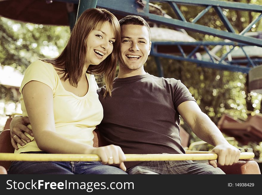 Laughing Couple On The Carousel