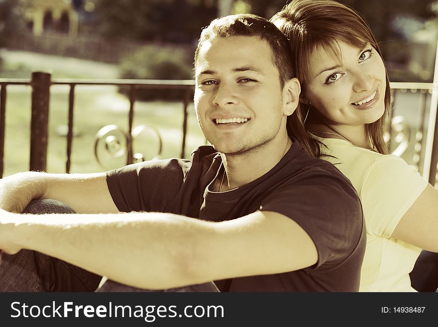 Portrait of couple on the bench in the park