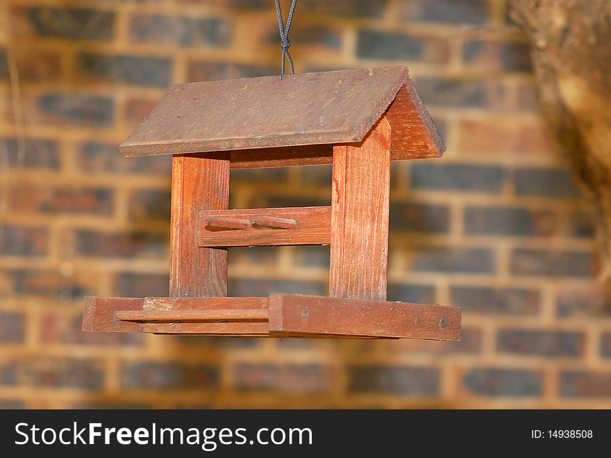 A bird feeder in a tree