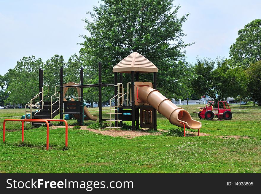Slides and other playground equipment in a public park