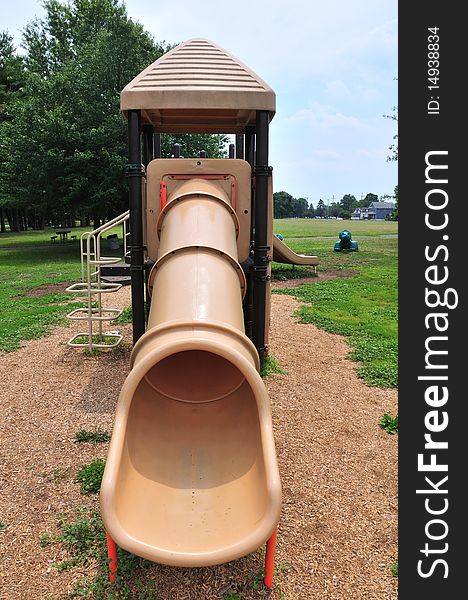 Slides and other playground equipment in a public park