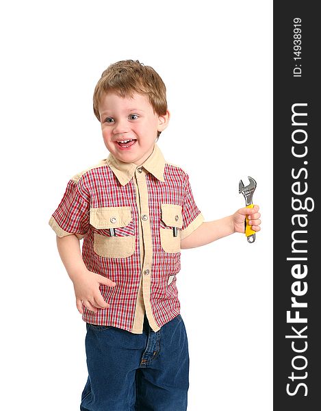 The little boy with a wrench on the white. The little boy with a wrench on the white